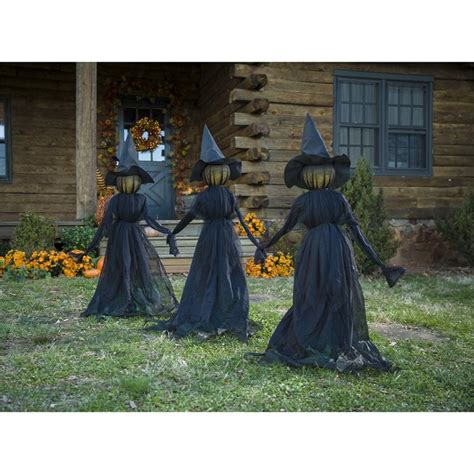 Add some charm to your Halloween decorations with playful witch stakes figurines
